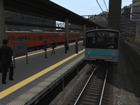 Der Bahnhof Sugomori Minato mit der JR Baureihe 205.
